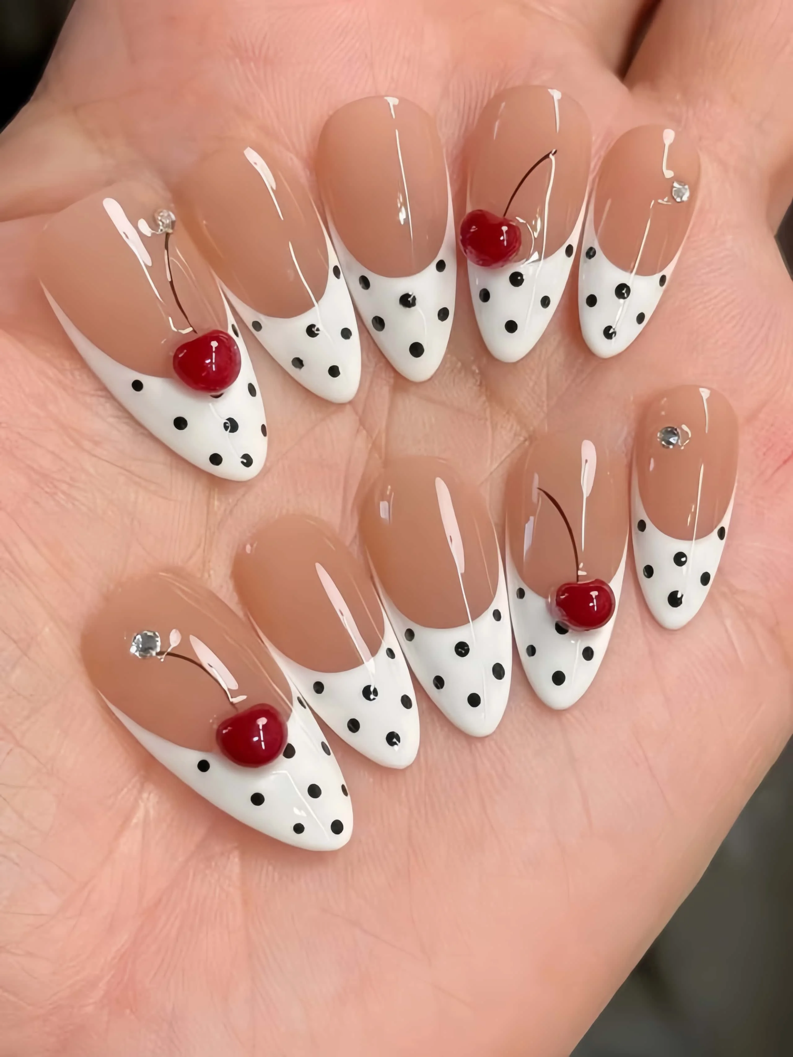 10 Pieces of Handmade Almond-Shaped Full-Cover Nail Tips, Medium-Length, with a Nude Base Color Paired with White French Style, Black Polka Dots, and 3D Red Cherry Rhinestones, in a Retro Sweet Girl Style, Suitable for Women and Girls, Perfect for Summer Vacations, Graduation Season, and as a Gift, Comes with 1 Piece of Jelly Glue and 1 Nail File