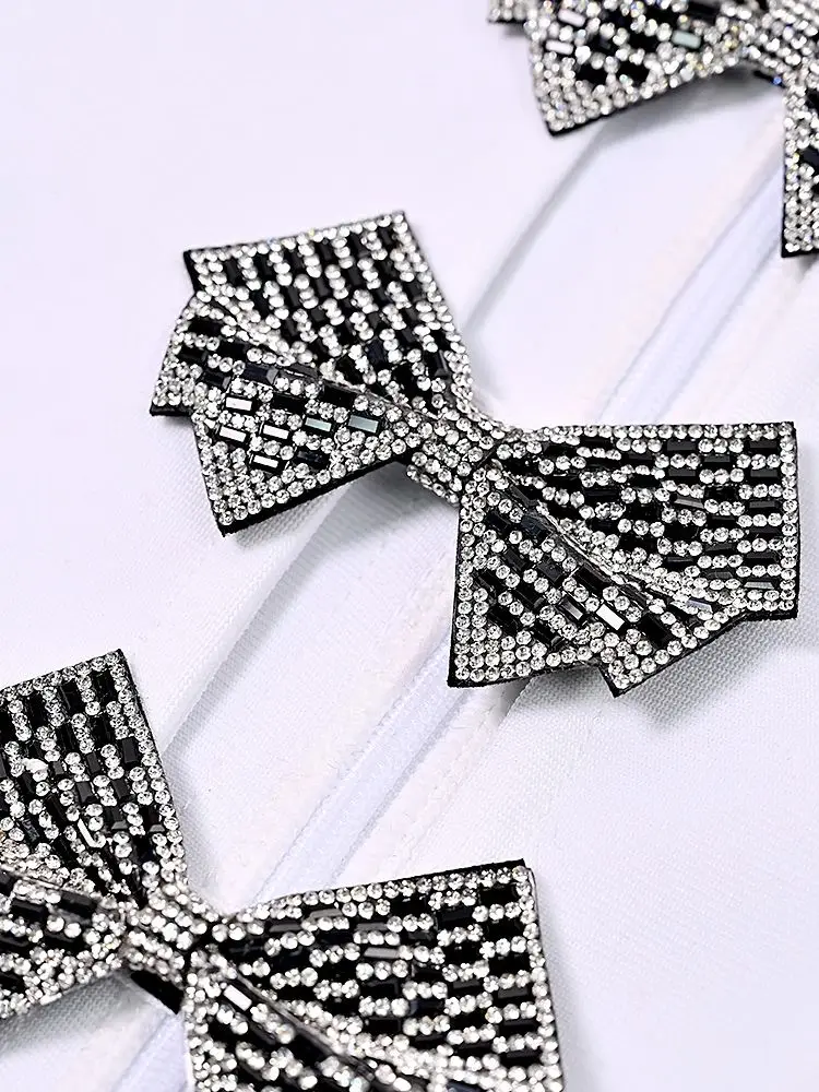 فاخر كريستال القوس ضمادة ثقب المفتاح فستان سهرة أبيض جوفاء قصيرة الأكمام الخريف فستان الحفلات مع حجر النساء المشاهير