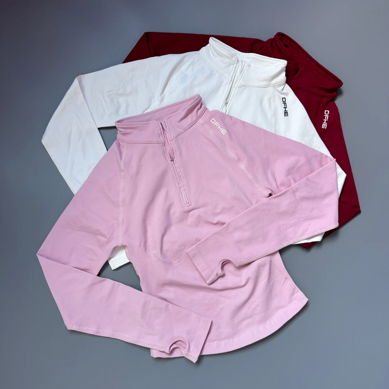 Haut de sport à manches longues pour femme DF Impact, demi-zip, avec trous pour les pouces, séchage rapide, élastique, pour la course, l'entraînement et le fitness