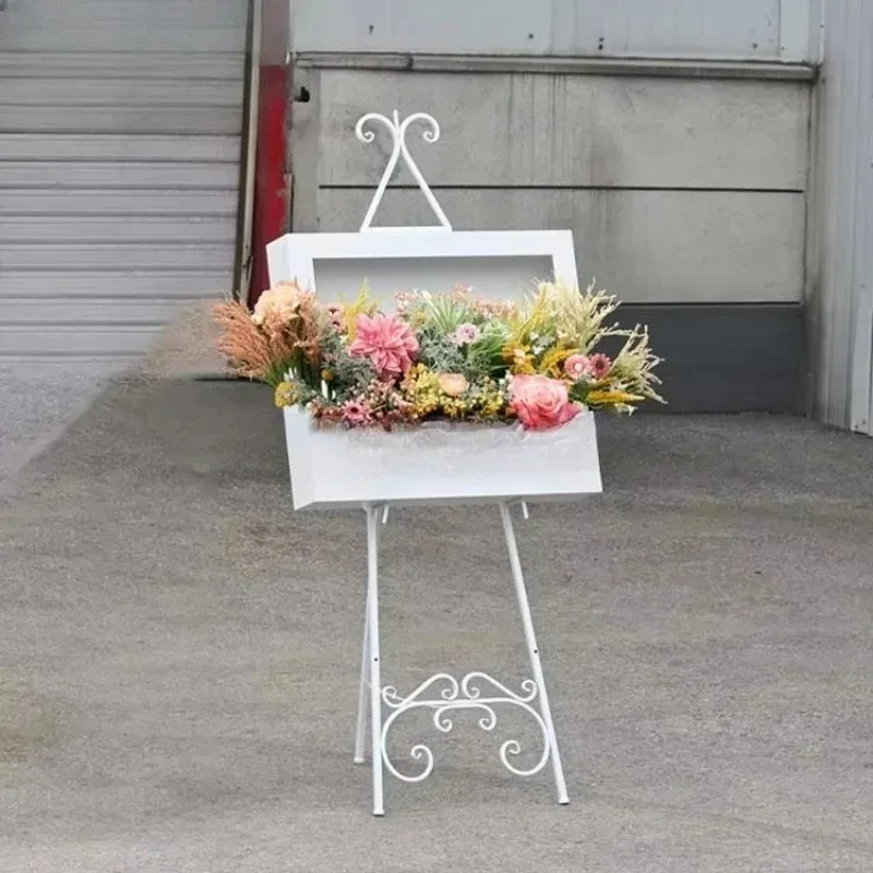 White floral box decoration with custom shelf display backdrop, used for wedding entrances