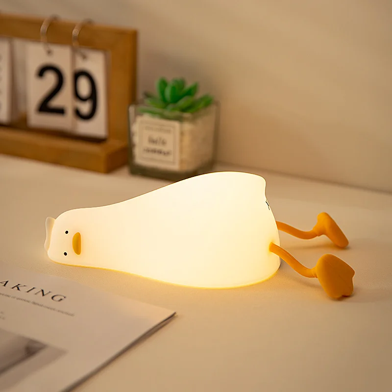 Lying Flat Duck Night Light Silicone Squishy Rechargeable Tap Control 3 Brightness 30 Min Timer Phone Holder for Bedside