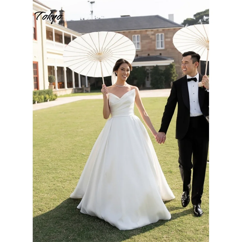 طوكيو مخصص الأبيض الحبيب الرقبة فستان الزفاف بلا أكمام الظهر البريدي ألف خط الزفاف الحجاب قطار المحكمة ثوب زفاف أنيق