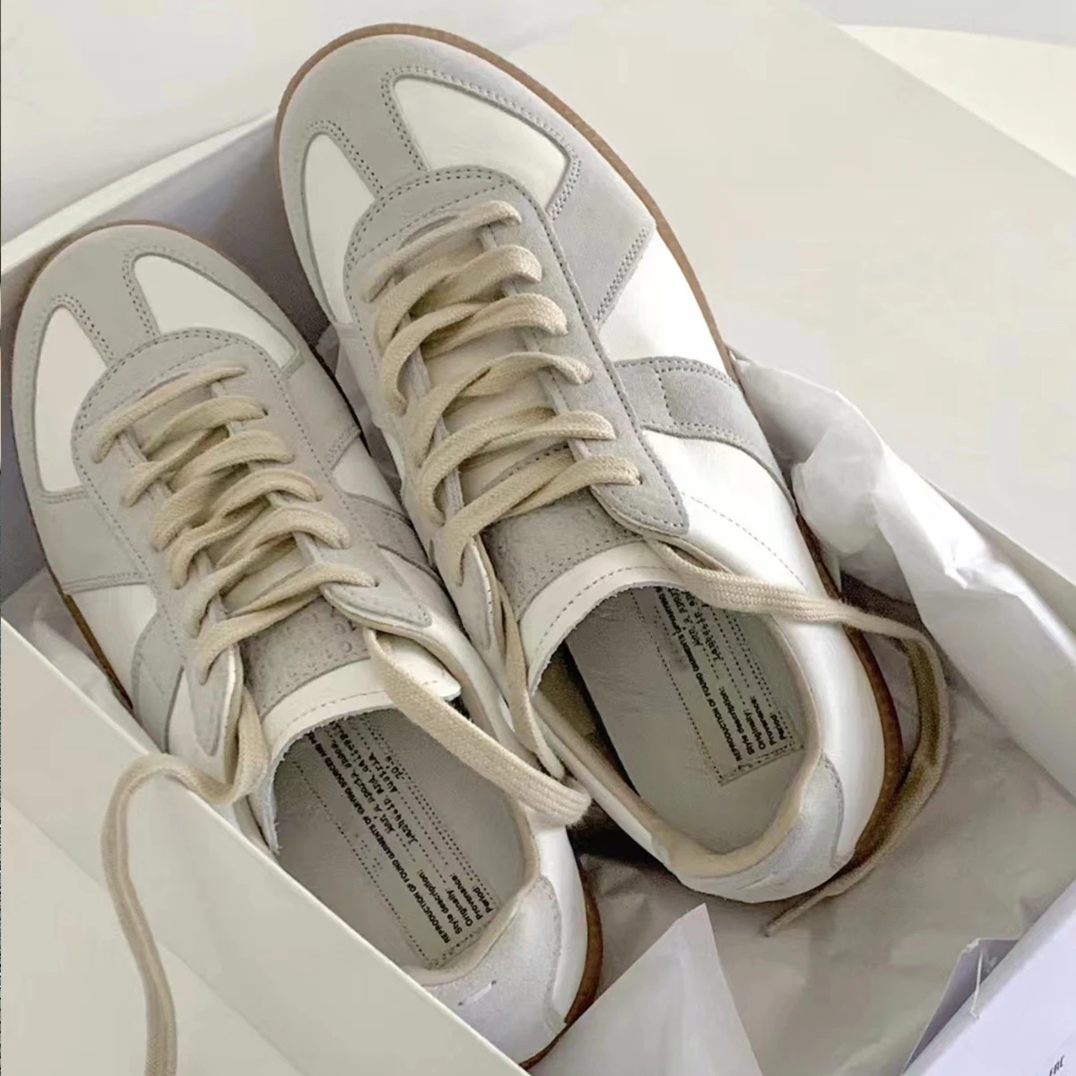 Marca de diseñador, entrenamiento alemán para hombres, pisos de cuero, zapatillas de deporte para mujeres, zapatillas planas informales para niños, liquidación barata