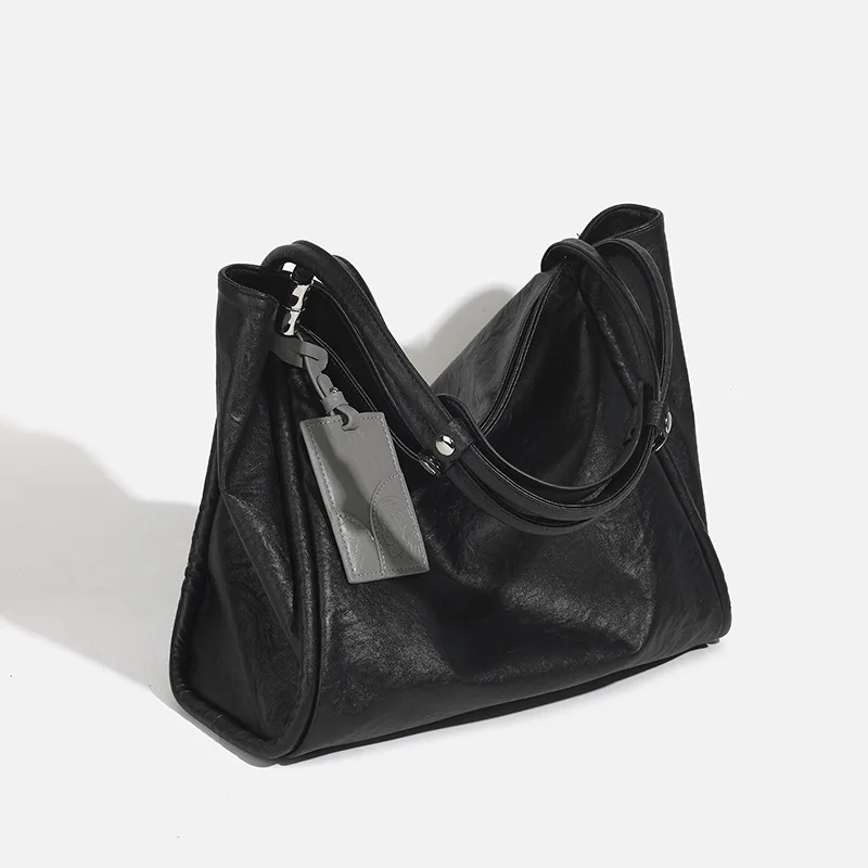 

Нишевая дизайнерская кожаная черная большая сумка большой вместимости, женская новинка весны 2025 года, пригородная сумка на плечо, большая сумка под мышками