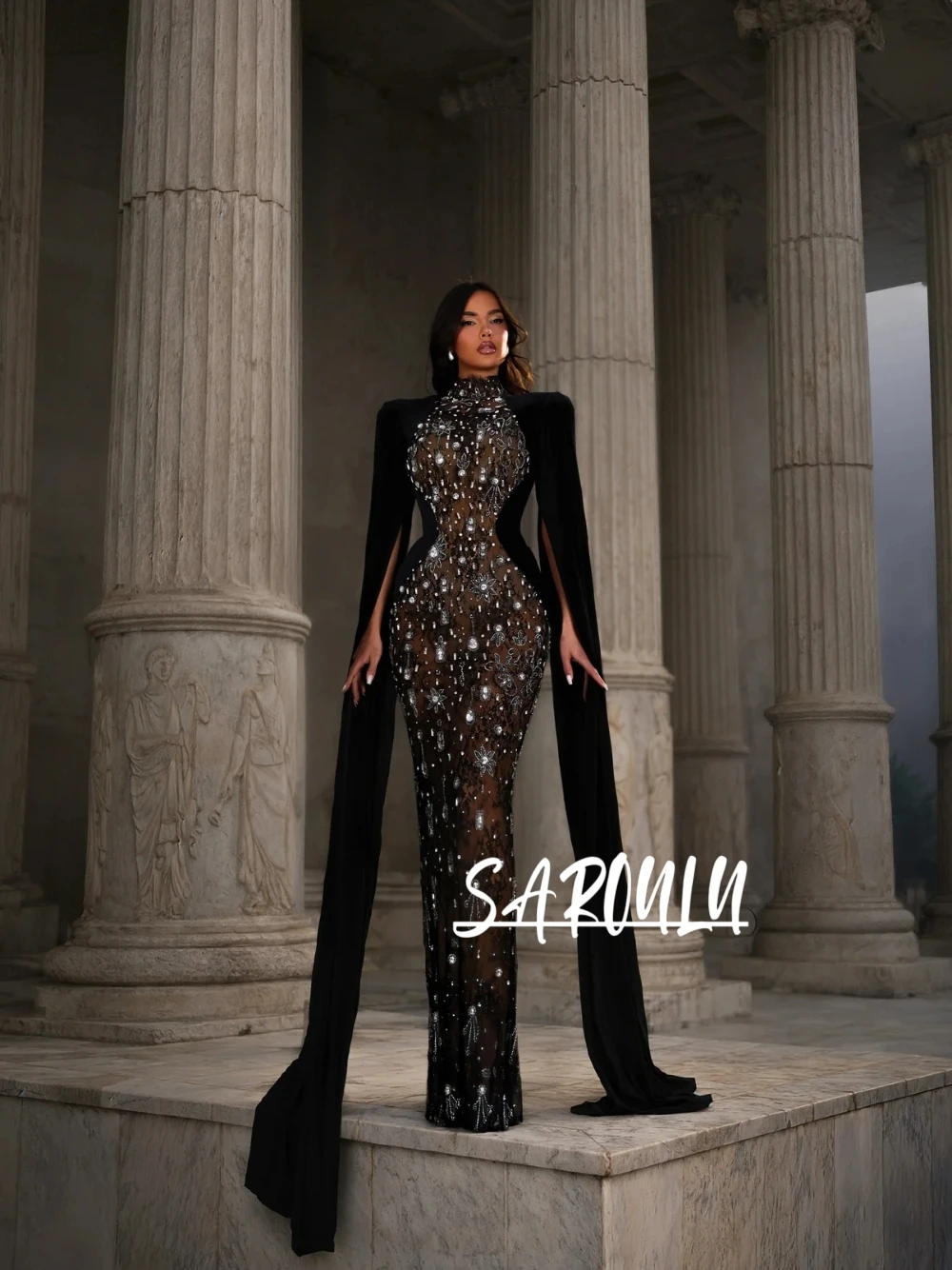 

Luxury Black Cape Sleeves Crystal Embellished Evening Dress Glam Sexy Sheer Bodycon High Neckline Formal Party Gown Customized