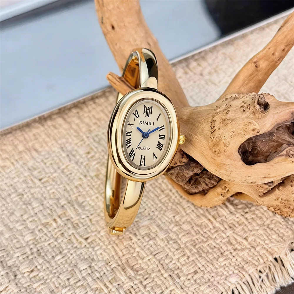 

Женские золотые часы-браслет XIMILI с овальным циферблатом и римскими цифрами, кварцевые, винтажные, элегантные наручные часы для женщин