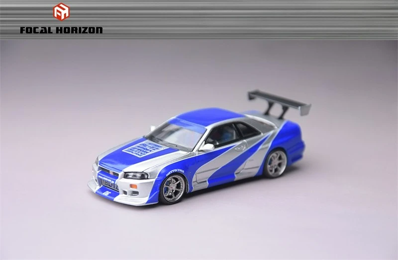 

Литая модель автомобиля Focal Horizon FH 1:64 Skyline R34 C-West NFS SilverBlue