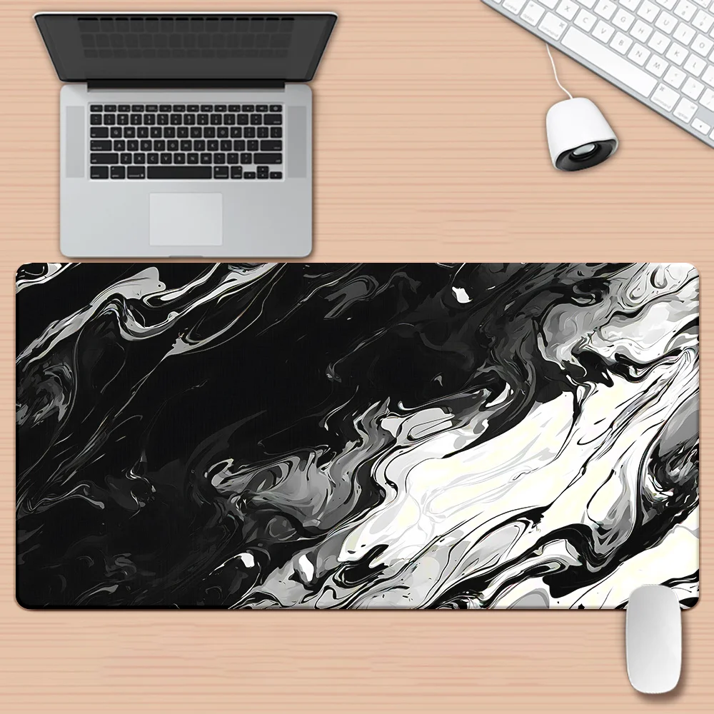 

The large black and white wave-designed game mouse pad with anti-slip rubber is suitable for both office and home use