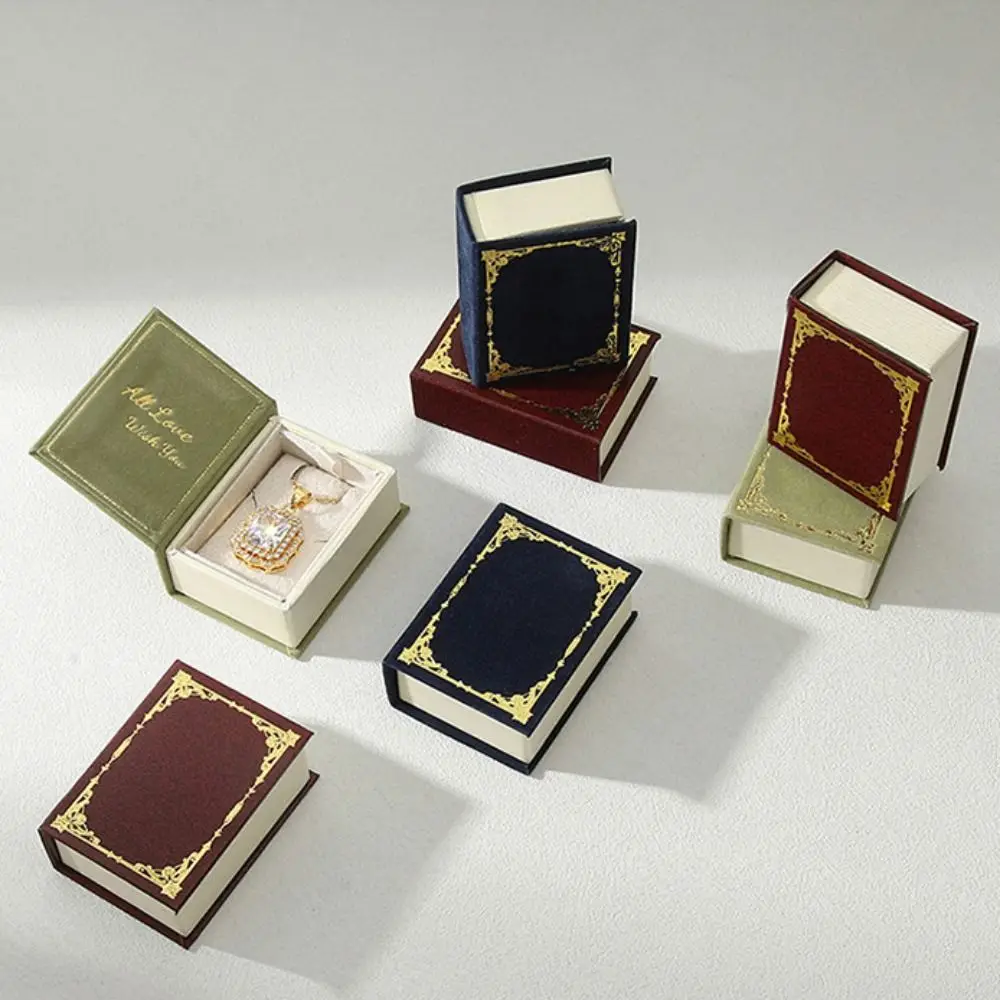 

Маленькая креативная коробка для колец в форме книги, откидная крышка, магнитный чехол для обручального кольца, чехол для сережек, бархатная упаковка для ювелирных изделий, путешествия