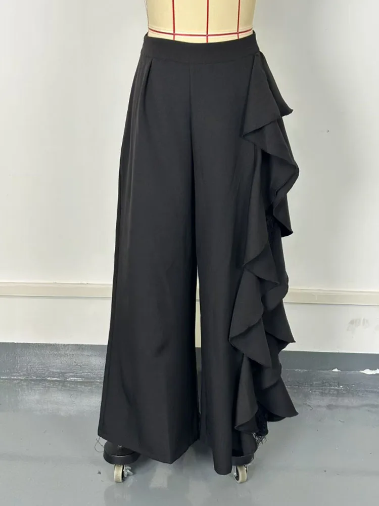 Pantaloni alla moda e cadenti in rete di pizzo irregolare a fessura a vita alta