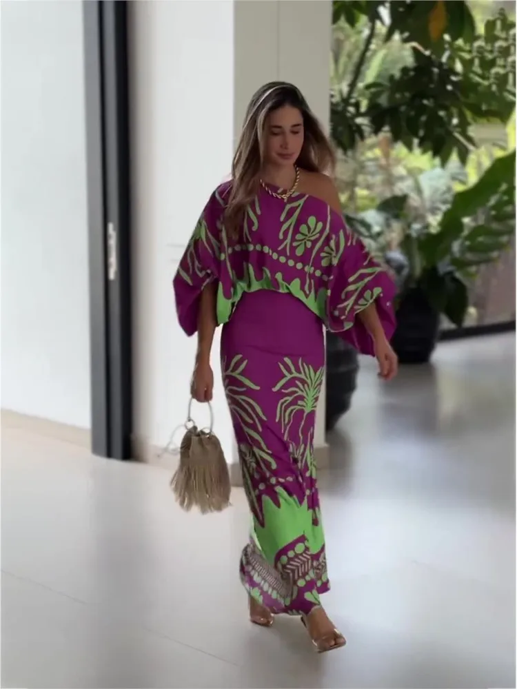 セクシーな女性用プリントツーピースセット 2026年春新作 オフショルダーシャツ ハイウエストロングスカートセット レディース服