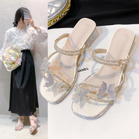 Two women wearing bow sandals 2025 summer new wear thick heel fashion French transparent fairy wind cool slippers