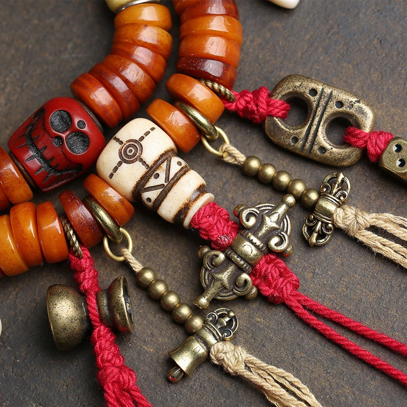 Tibetan-style multi-strand hand-held prayer with 108 bone beads and copper accessories