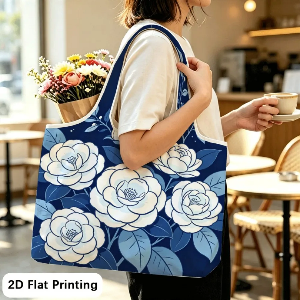 Camellias shine on deep blue Foldable tote shoulder bag, easy to fold and put away fast.