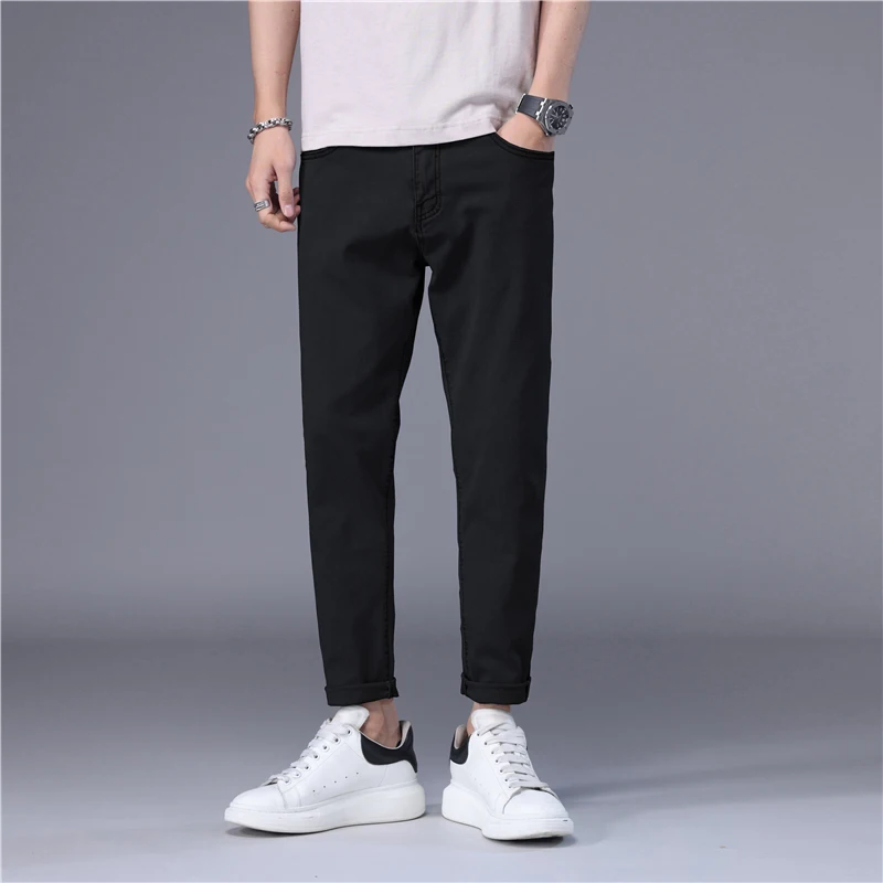 ฤดูร้อนกางเกงยีนส์ผู้ชายบางสไตล์เกาหลีสีฟ้าสีดําสีทึบยืดตรงสไตล์ SLIM FIT เท้า DENIM Cropped กางเกงชาย