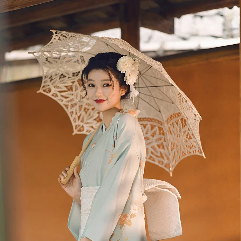 女性の日本の伝統的な袖の長い着物美しい緑色の古典的な浴衣パフォーマンスドレスコスプレ衣装写真着用