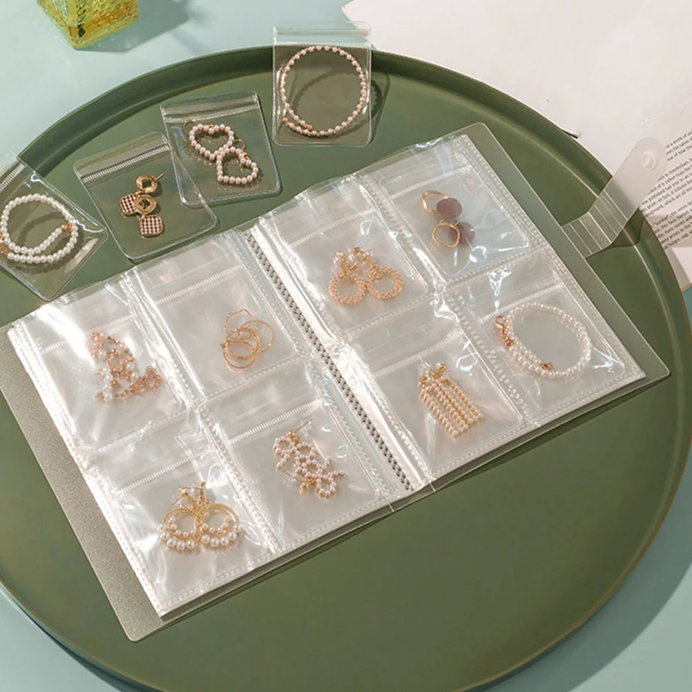 

1 комплект, книга для хранения ювелирных изделий, прозрачный органайзер, книга, маленькие сумки для ювелирных изделий, отдельные карманы, органайзер для колец, сережек, 84 слота