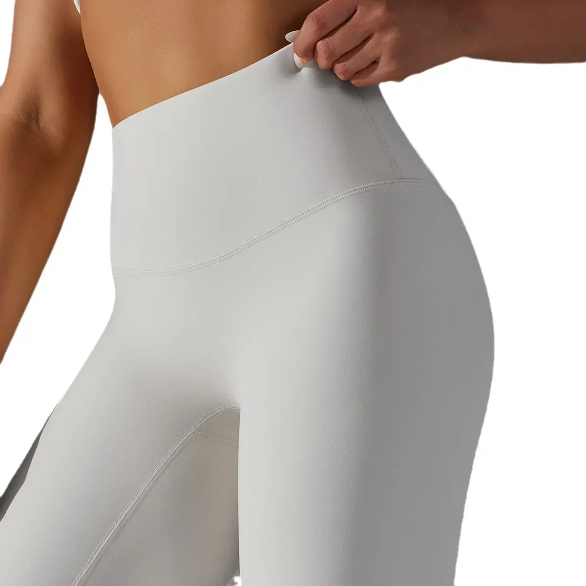 Pantaloni fitness sportivi per il sollevamento dell'anca color pesca a vita alta da donna senza imbarazzo e pantaloni da yoga nudi spazzolati a doppia faccia