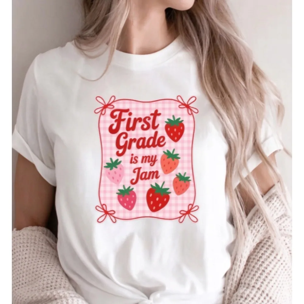 Women Crew Neck Short Sleeve White T-Shirt, First Grade Is My Jam Strawberry Plaid Bow Frame Graphic Cute Back To School