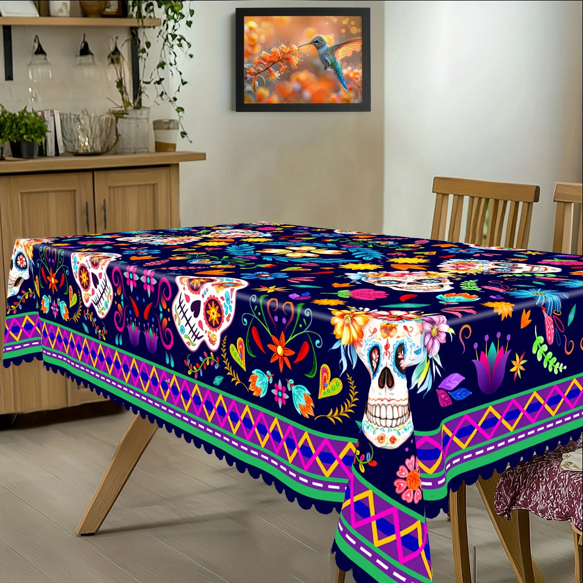 One Dia de los Muertos (Day of the Dead) celebration tablecloth, colorful skulls, Mexican floral pattern decoration.PMJ
