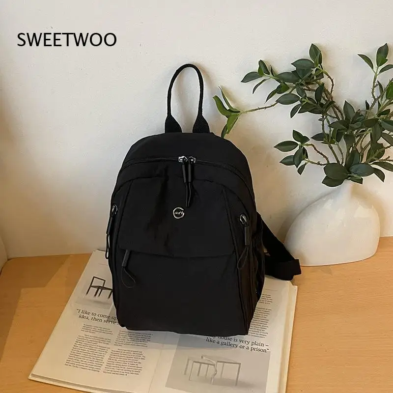 Women Lightweight Crinkle Nylon Backpack Multiple External Zipper Pockets Emblem Adjustable Shoulder Straps Casual Backpack