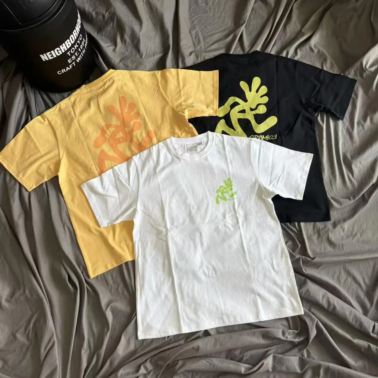 

Running Cartoon People Print Gramicci T Shirt Japan Style Men Women High Quality Black White Yellow Loose T-shirt Tops Tee