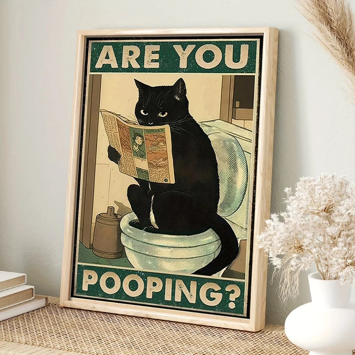 

The little black cat is reading newspapers, funny posters, retro art decorations in the bathroom