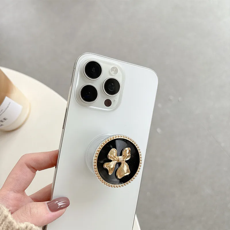 

Luxury Metal Pearl Heart Bow Fold Finger Grip Ring Mobile Phone Stand Holder For Iphone 15 16 17 Samsung Holder Stand Bracket