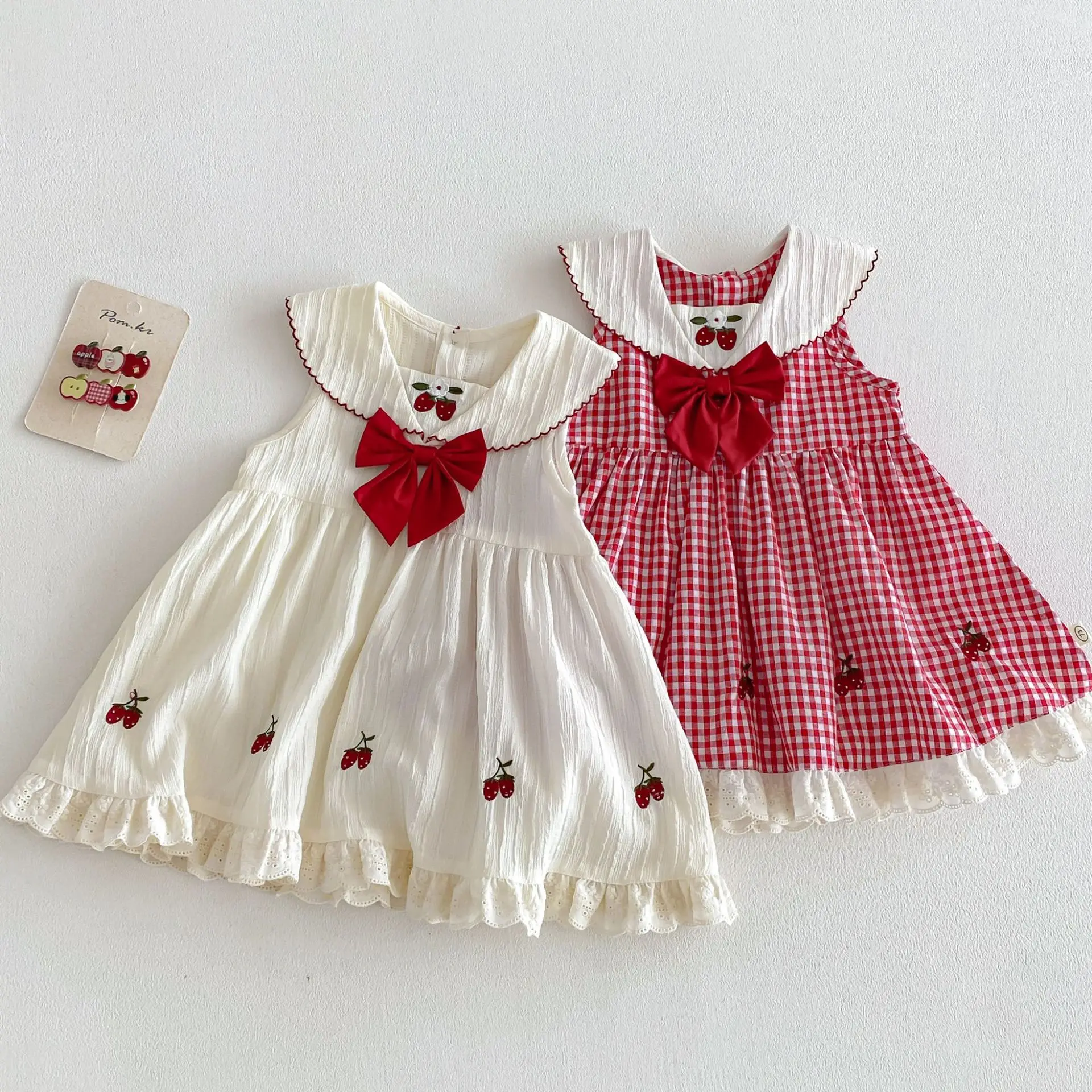 

Детское платье «Принцесса-клубничка» 2026: Новое летнее корейское клетчатое платье с бантом для девочек, детская юбка