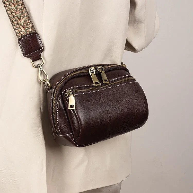 

Women's real leather high-end single-shoulder small round bag retro multi-layer diagonal cross commuting small backpack