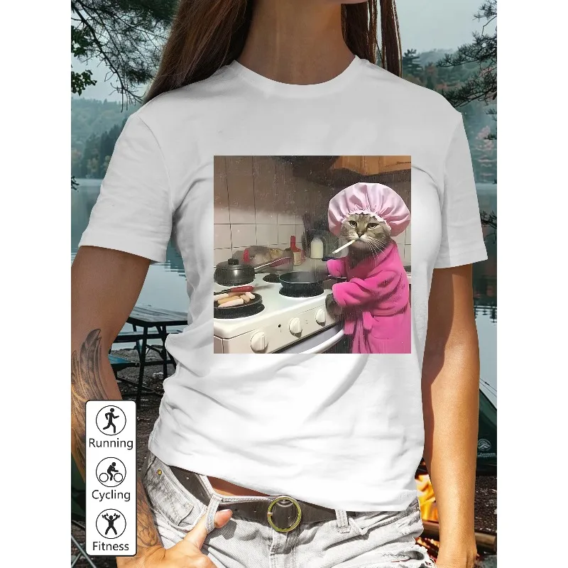 

Ladies' Casual T-shirt Featuring A Cat Wearing A Pink Bathrobe and A Shower Cap Cooking in The Kitchen Printed on A Women's Top