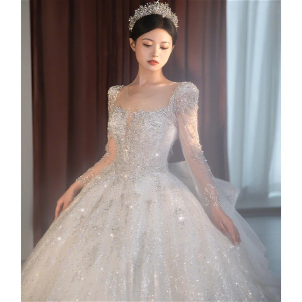 Exquisite 2024 Square Collar Wedding Dresses Illusion Backless Sequin Bridal Gowns A-Line Long Sleeves Princess Dress A015