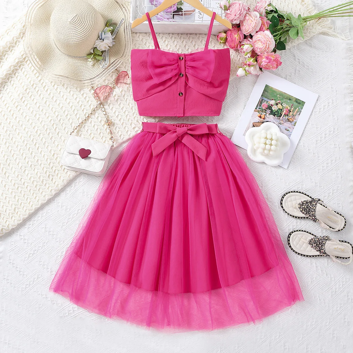 

Foshan Children's Clothing 2024 Summer Western Style Hanging Strap Bow Short Tank Top Mesh Half Skirt Girls' Set