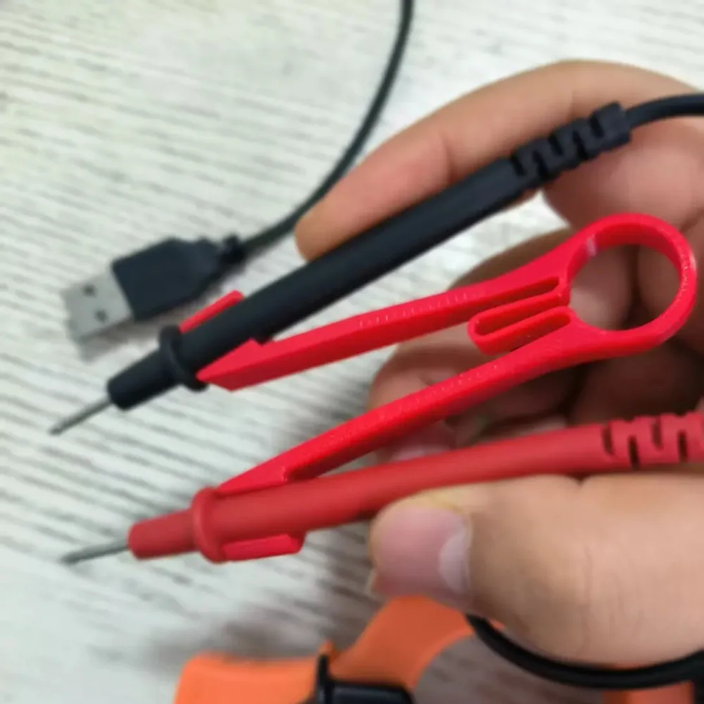 Multimeter probe holder Multimeter probe holder One-handed operation clip artifact