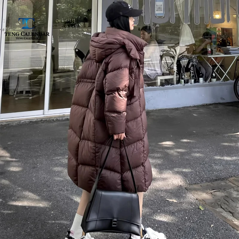 Puff ribbon duvet down jacket, medium length hooded thick Korean loose jacket, women's 2025 winter new style