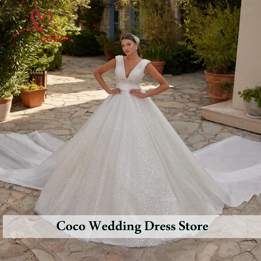 فستان زفاف فاخر مخصص من الأورجانزا مع تطريز مطرز بالخرز على شكل حرف v بدون أكمام فستان الزفاف فيستدو دي نوفيا #1