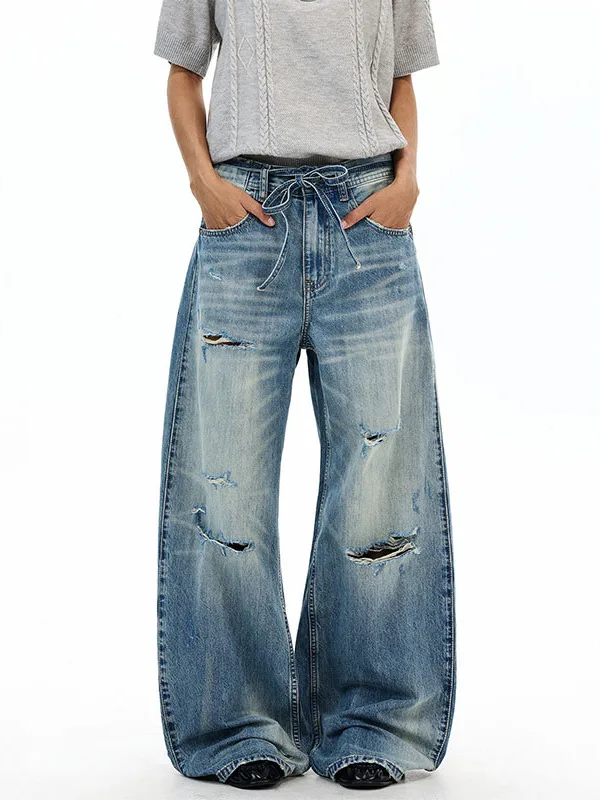 Calças Jeans Retrô Americanas Lavadas com Rasgos e Detalhes de Corte, Cintura Solta, Perna Reta e Larga, para Homens e Mulher...