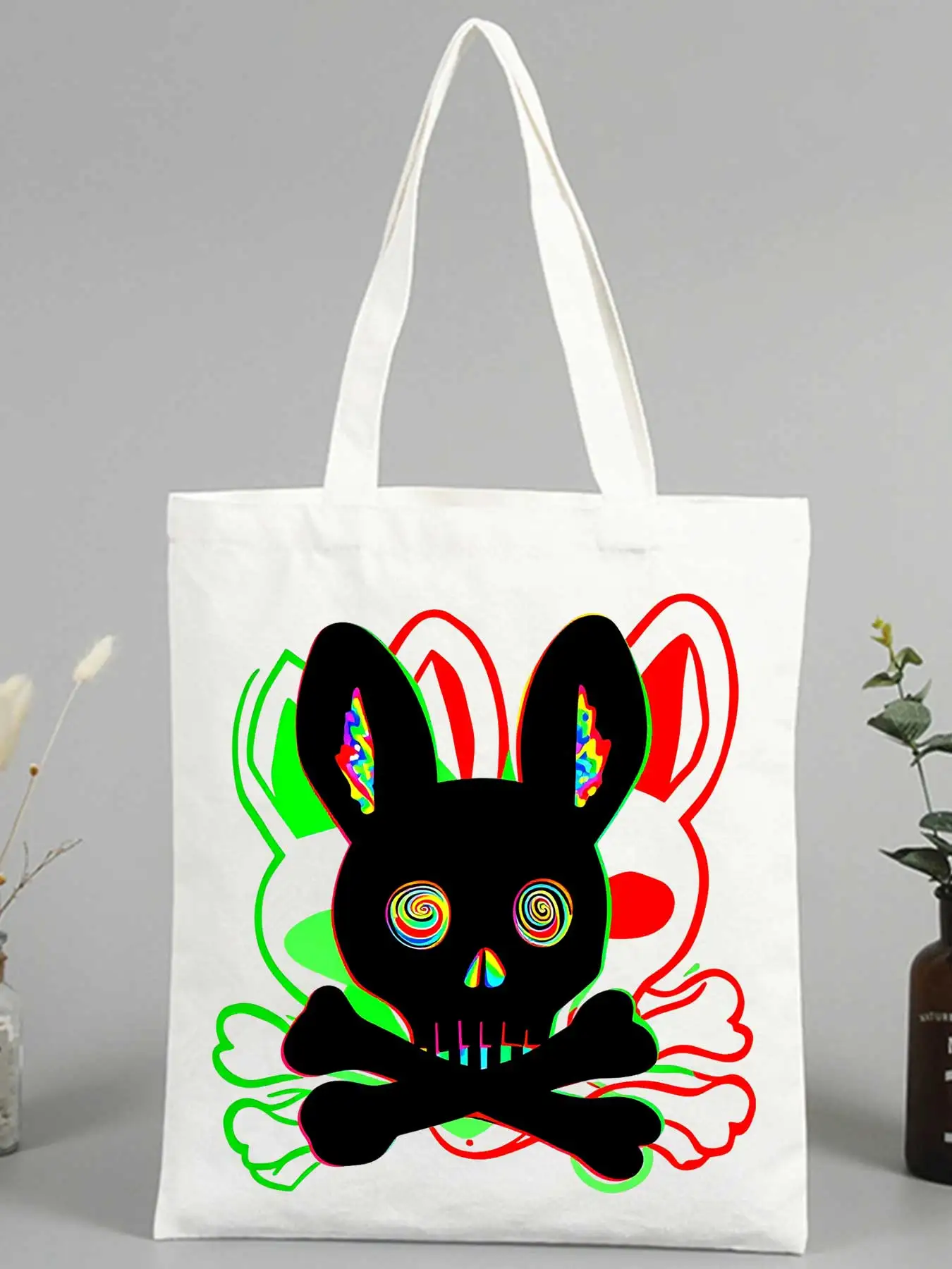 canvas tote bag with rabbit skull and crossbones graphic, streetwear style for casual daily use