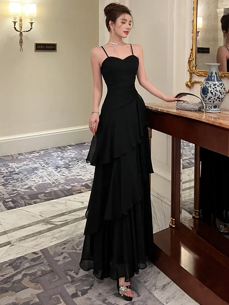 A new Hepburn style halter design with cinched waist and ruffled hem long skirt