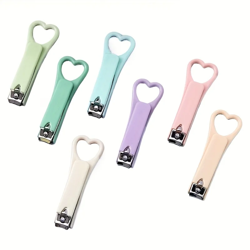 7 szt. Kolorowe obcinaczki do paznokci w kształcie serca - Różne pastelowe kolory: różowy, żółty, zielony, niebieski, fioletowy. Przenośne narzędzie do pielęgnacji paznokci.