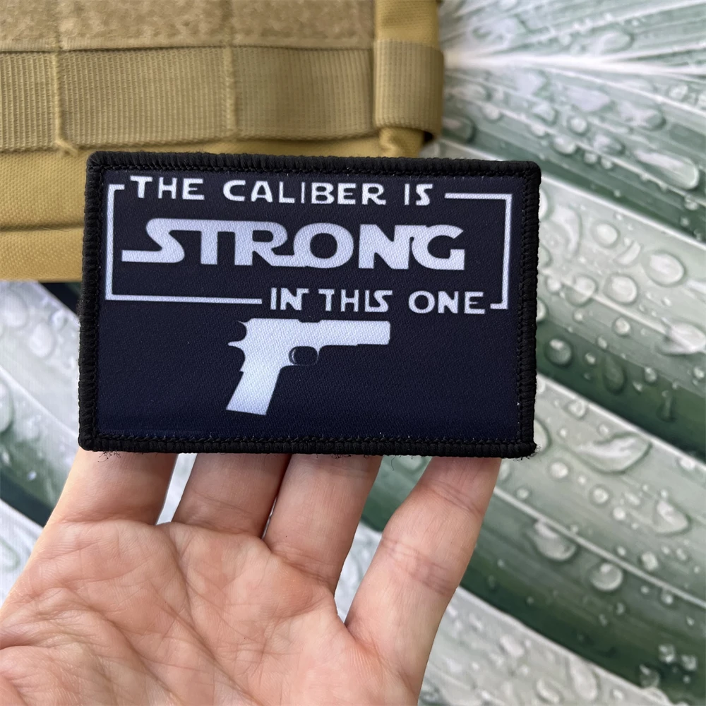 

THE CALIBER IS STRONG IN THIS ONE Morale Badge Patches Tactical Military ARMY Hook&Loop Backpack Printed Sticker