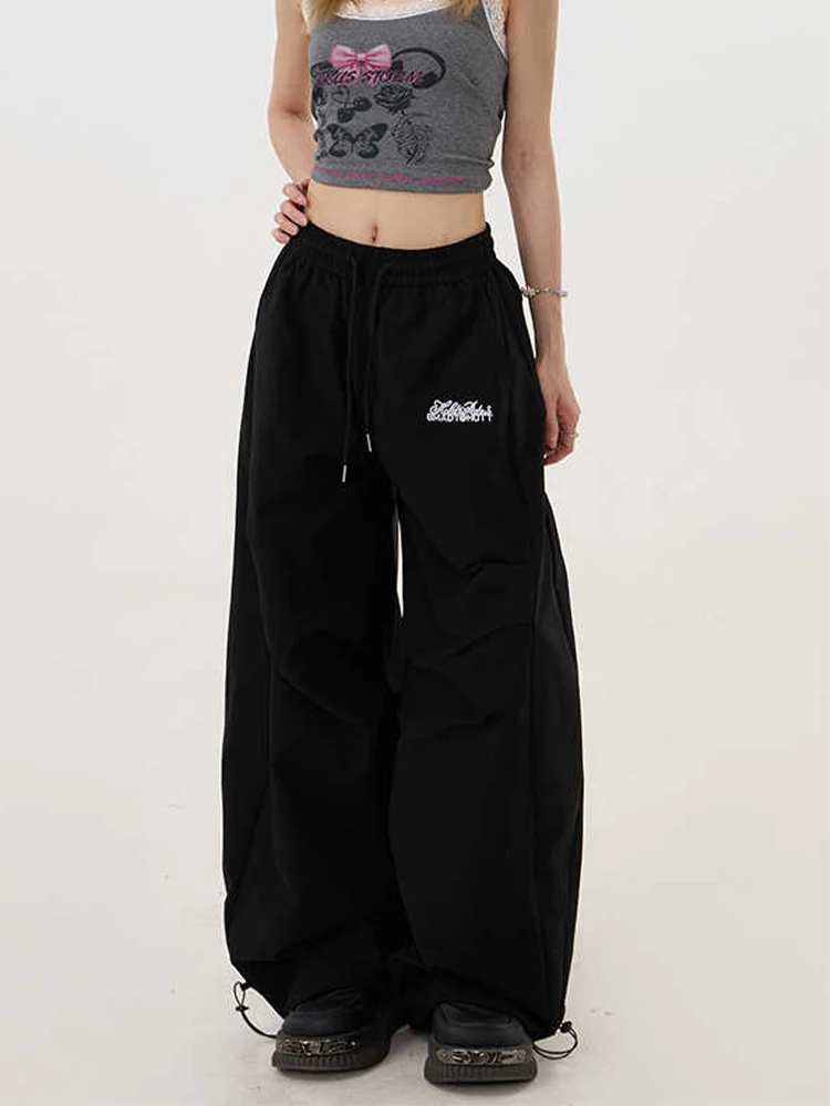 กางเกงทรงพาราชูทขาบานสไตล์ไฮสตรีทสำหรับผู้หญิง ฤดูใบไม้ร่วง-ฤดูหนาว 2025 รุ่น Y2K กางเกงขายาวทรงหลวมสไตล์ฮาราจูกุยุค 2000s แนวกรันจ์อเมริกันย้อนยุคทรงบอยแบงค์
