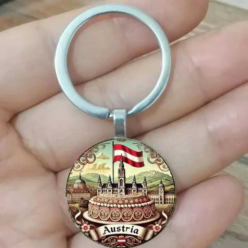Österreichische Architektur- und Bergblick-Schlüsselanhänger mit Flaggen sind einzigartige Geschenke für Natur- und Kulturliebhaber, perfekt für ho