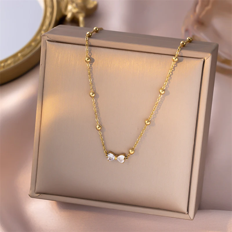 316L الفولاذ المقاوم للصدأ مجوهرات الأزياء الجديدة الفتيات الصغيرات على شكل قلب الزركون Bowknot سلسلة سحرية قلادة سوار القرط للنساء