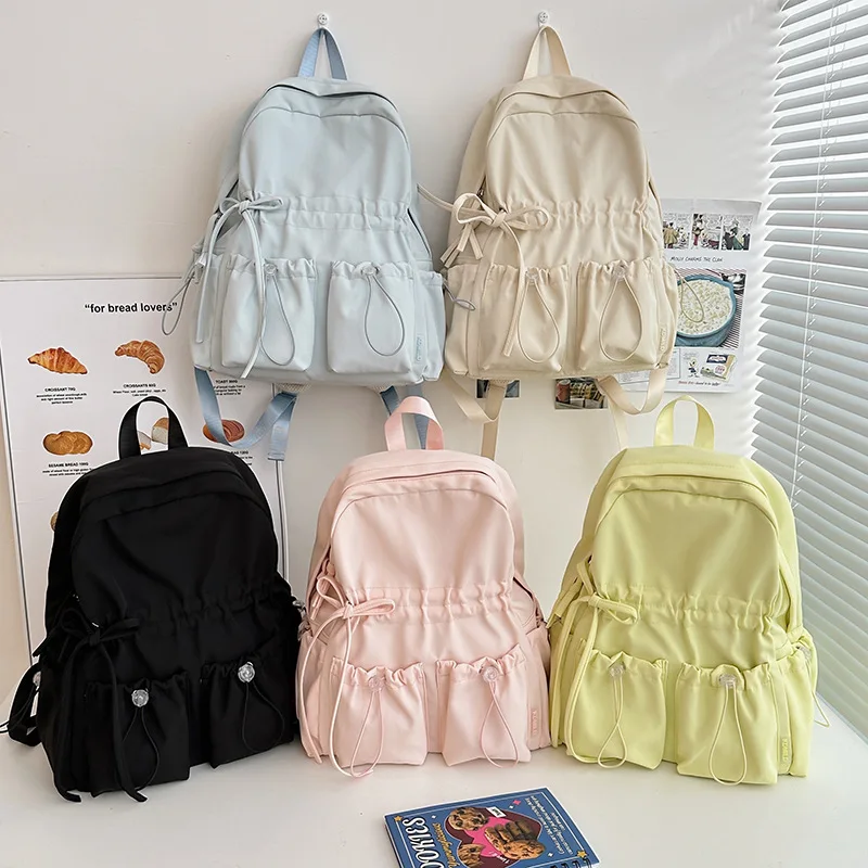 

Large capacity school bag, cute girl bow, high school backpack, high looks college backpack for female students