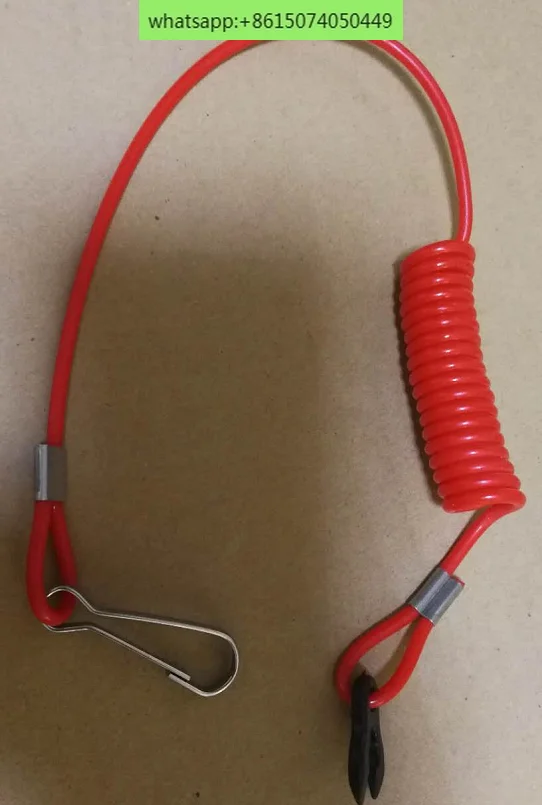 Sakelar penyalaan tempel dan tali merah pengaman