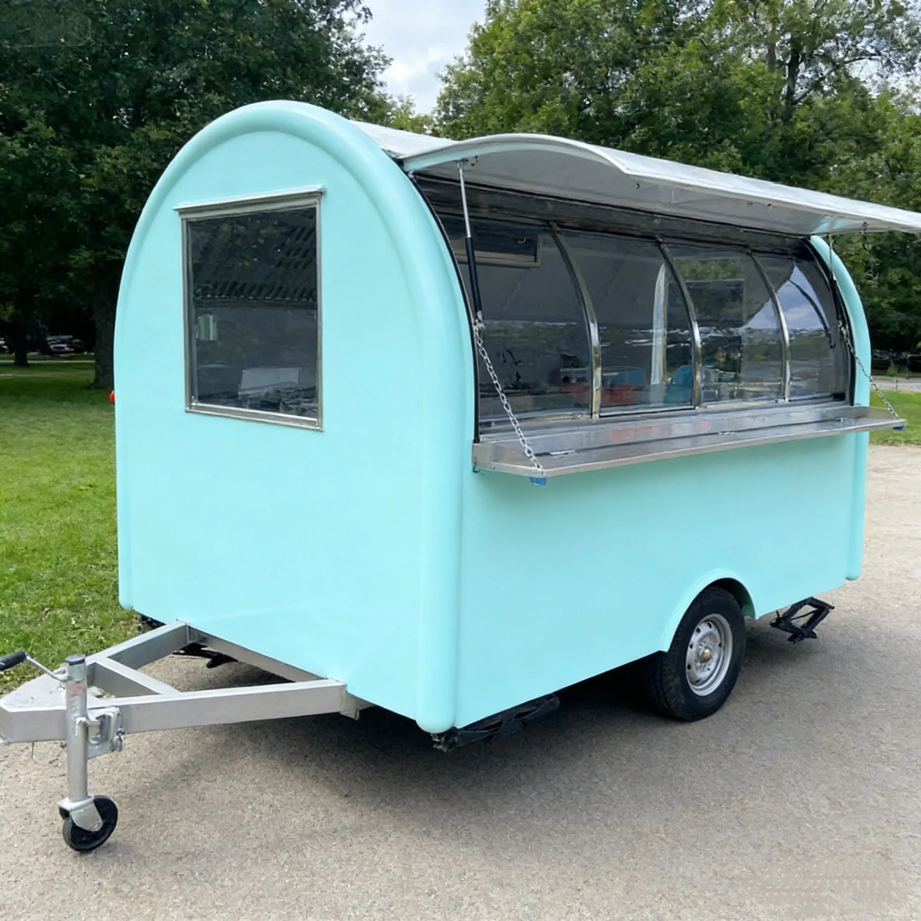 Small Mobile Food Truck Converted Into a Food Truck Equipped with a Complete Set of Kitchen Equipment