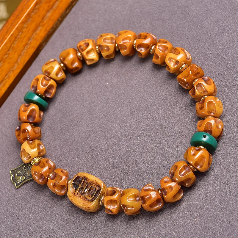

Yak carved large intestine and passion seed bracelet, Tibetan-style old spirit bone beaded jewelry, single-loop barrel bead