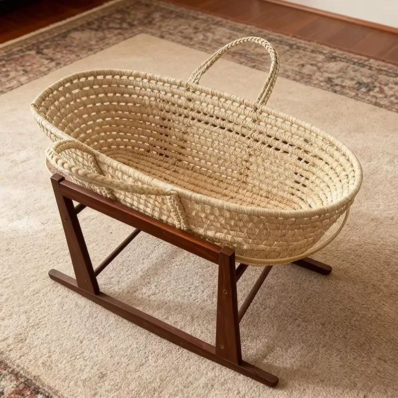 Newborn baby sleeping corn husk crib wicker moses basket wicker basket crib