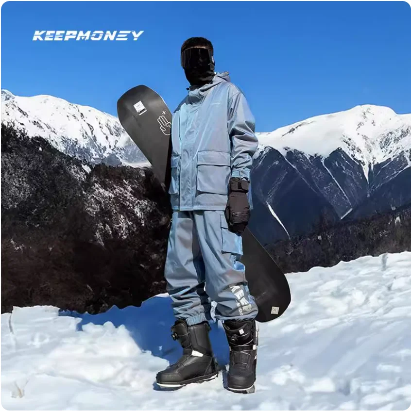 بدلة تزلج على الطراز الأمريكي الجديد من KEEPMONEY 2025 للجنسين مقاومة للماء على الجليد مع بطانة من الصوف مجموعة رياضية شتوية حرارية